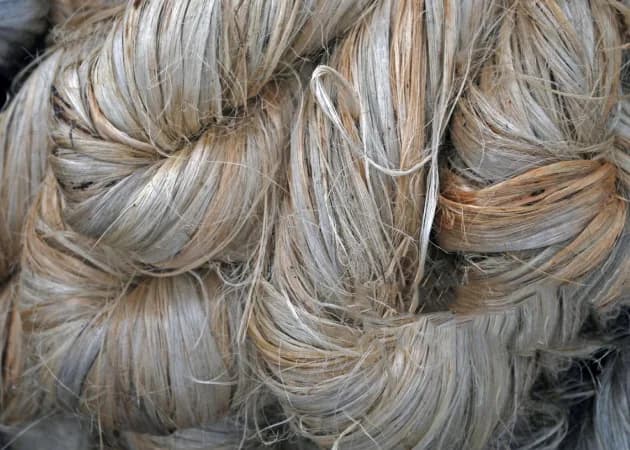 Raw jute fibre in graded bales — starting point for yarn, fabrics, bags, and rope